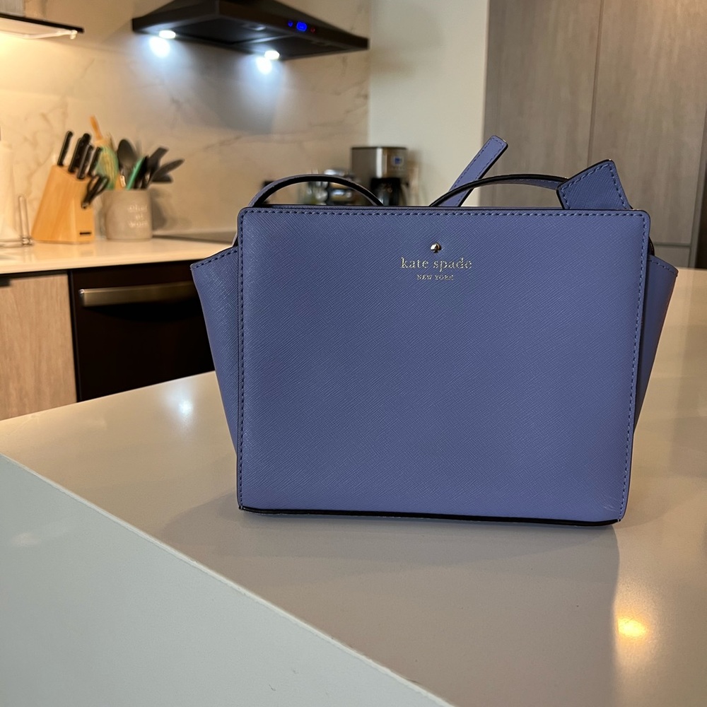 Lavender Kate Spade purse with shoulder strap